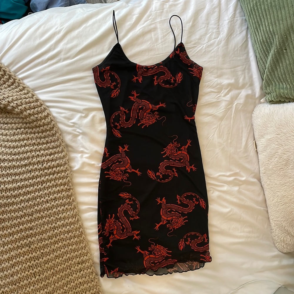 Black mini dress with red Chinese dragon pattern